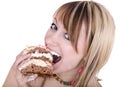 Girl eating piece of cake. Royalty Free Stock Photo