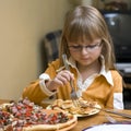 Girl eating pizza