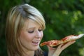 Girl eating pizza slice Royalty Free Stock Photo