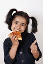 Girl eating pizza slice Royalty Free Stock Photo
