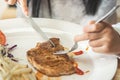 Girl eating pork steak with Vegetables Royalty Free Stock Photo