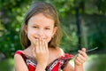 Girl eating raspberry Royalty Free Stock Photo