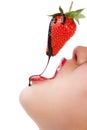 Girl eating strawberry with chocolate sauc Royalty Free Stock Photo