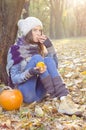 Girl eating tangerine in the park Royalty Free Stock Photo