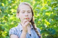 Girl eating wild strawberries