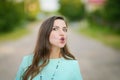 The girl eats cherries. walking down the street, lively emotions, attractive young woman bare shoulders hold cherry open mouth Royalty Free Stock Photo