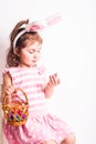Girl eats a chocolate eggs Royalty Free Stock Photo