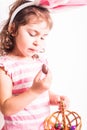 Girl eats a chocolate eggs Royalty Free Stock Photo