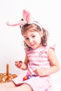 Girl eats a chocolate eggs Royalty Free Stock Photo