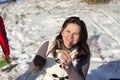 Girl eats kebab outdoors in winter Royalty Free Stock Photo