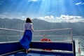 The girl on the edge of the ship sails on the sea Royalty Free Stock Photo