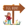 Girl with eggs next to the eggs hunt shield and little chick walking Royalty Free Stock Photo