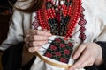 A girl embroiders vyshyvanka pattern