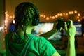 The girl emotionally plays video games with a headset, and a joystick, controller, gamepad. On the computer online with her Royalty Free Stock Photo