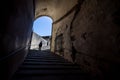 The girl at the end of the tunnel with stairway in Palazzo Pitti Royalty Free Stock Photo