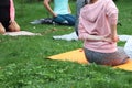 The girl is engaged in nature yoga. Pair yoga or acro yoga