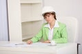 Girl engineer in white helmet on workplace Royalty Free Stock Photo