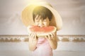 Girl enjoy a watermelon at coast Royalty Free Stock Photo