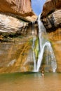 Girl enjoying a dip in Lower calf creek falls in the Grand staircase escalante national monument, Utah, USA Royalty Free Stock Photo