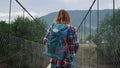 Girl enjoying mountain hitchhike on summer nature landscape. Woman walk outside. Royalty Free Stock Photo