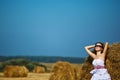 Girl enjoying the nature on fresh straw