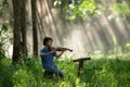 Girl is enjoying playing violin or playing his music in the wild Royalty Free Stock Photo