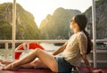 Girl enjoying the ride on a cruiser boat