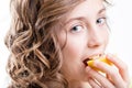 Girl enjoying sour taste of lemon