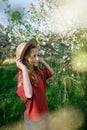 Girl enjoying spring blossoms in garden. Royalty Free Stock Photo