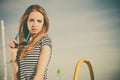 Girl enjoying summer breeze sky background Royalty Free Stock Photo