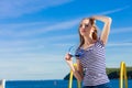 Girl enjoying summer breeze sky background Royalty Free Stock Photo