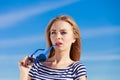 Girl enjoying summer breeze sky background Royalty Free Stock Photo