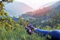 Girl enjoying summer rest ilying on green grass in mountains Royalty Free Stock Photo