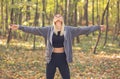 Girl enjoying the sun in the forest