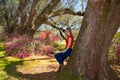 Smiling happy family enjoying time together in beautiful  blooming garden on a spring day Royalty Free Stock Photo