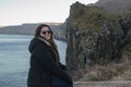 The girl enjoys the view of the cliffs of Northern Ireland.