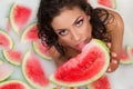 Girl enjoys a bath with milk and watermelon. Royalty Free Stock Photo