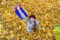 Girl enjoys good shopping. Young woman in autumn Park with shopping bags. Top view Royalty Free Stock Photo