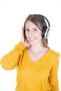 Girl enjoys musicians music in headphones on white background