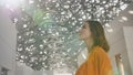 Girl enjoys views of the Louvre Hall in Abu Dhabi.