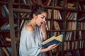 A girl enthralled looks into the book with astonishment. Shocking an unexpected intrigue story. Royalty Free Stock Photo