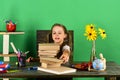 Girl with enthusiastic face takes book. Back to school Royalty Free Stock Photo