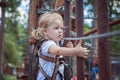 Girl in the equipment overcomes the obstacle. Royalty Free Stock Photo