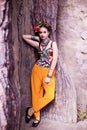 Girl in ethnic clothes in tropical garden Royalty Free Stock Photo