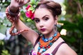 Girl in ethnic clothes in tropical garden with snake Royalty Free Stock Photo