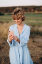 Girl in Euphoria, look at your phone grinning while waiting for a call Royalty Free Stock Photo