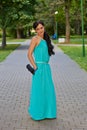 Girl in evening dress in the Park