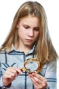Girl examines silver collection coins isolated Royalty Free Stock Photo