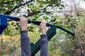 Girl exercising at outdoors gym playground equipment Royalty Free Stock Photo