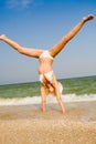 Girl exercising at sea beach Royalty Free Stock Photo
